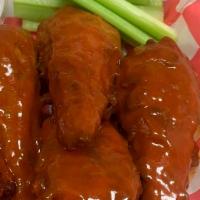 Vegan Buffalo Chicken · 3 piece Vegan chicken battered and deep fried in Vegan buffalo sauce. Served over rice with ...