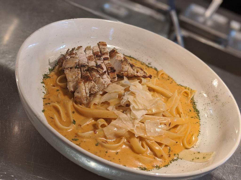 Chipotle Alfredo · Our Chipotle Alfredo is a flavor-rich pasta dish served with your choice of shrimp or chicken.