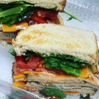 Turkey Bacon Cheddar Cheese Club Sandwich (Deli Style Sandwich) · 6 oz of Honey Roasted Turkey, with lettuce, tomato and bacon finished off with our. chipotle...