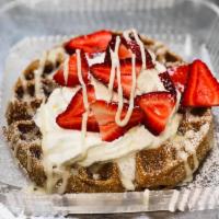 Buttermilk Spelt Waffles · Drizzled with Cream Cheese icing... served with fresh fruit of the day - usually Strawberry,...