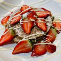 Vegan Spelt Pancakes with Strawberries and powder sugar · 