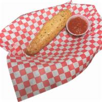 ADD Breadstick · One golden crust, soft in the middle, breadstick smothered in garlic butter with a side of g...