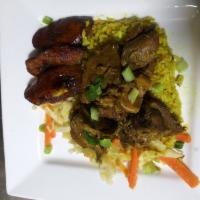 Curry Goat Dinner · Serves with 2 sides