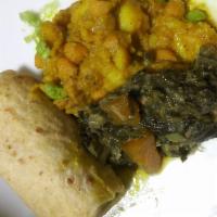 Veggie Roti - Unwrapped · Serves Dinner Style, with roti skin, spinach potato and chickpeas.