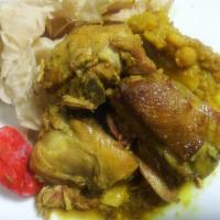 Curry Chicken with Buss up Roti · Serves Dinner Style, with roti buss-up, potato and chickpeas.