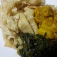 Veggie with  Buss up Roti · Serves Dinner Style, with roti buss-up, spinach, potato and chickpeas.