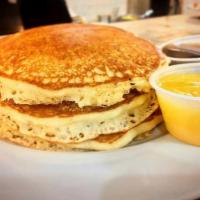 Evelyn's Homemade Pancakes · Full stack of fluffy, delectable pancakes served with butter and syrup on the side. Add stra...