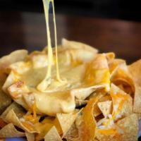 Adrian's Chile con Queso · Homemade flour tortilla bowl, queso made from 5 different cheeses, New Mexico green chile, o...