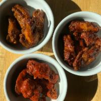 Wings · 3 flavors: tangy BBQ, sweet chile or red chile Buffalo.