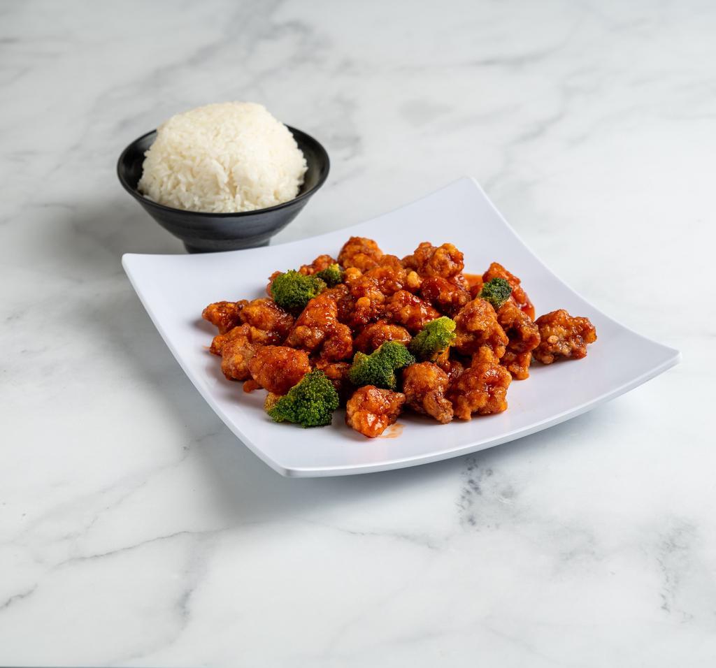 S4. Orange Chicken · Tender filet of marinated chicken delicately sauteed and seasoned in orange peel sauce. With white rice. Spicy.