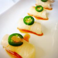 Yellowtail Jalapeno · Yellowtail sashimi with onion ponzu sauce, jalapeno on top.