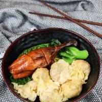 Roast Duck Leg and Wonton Noodles · Chinese dumpling that comes with filling.