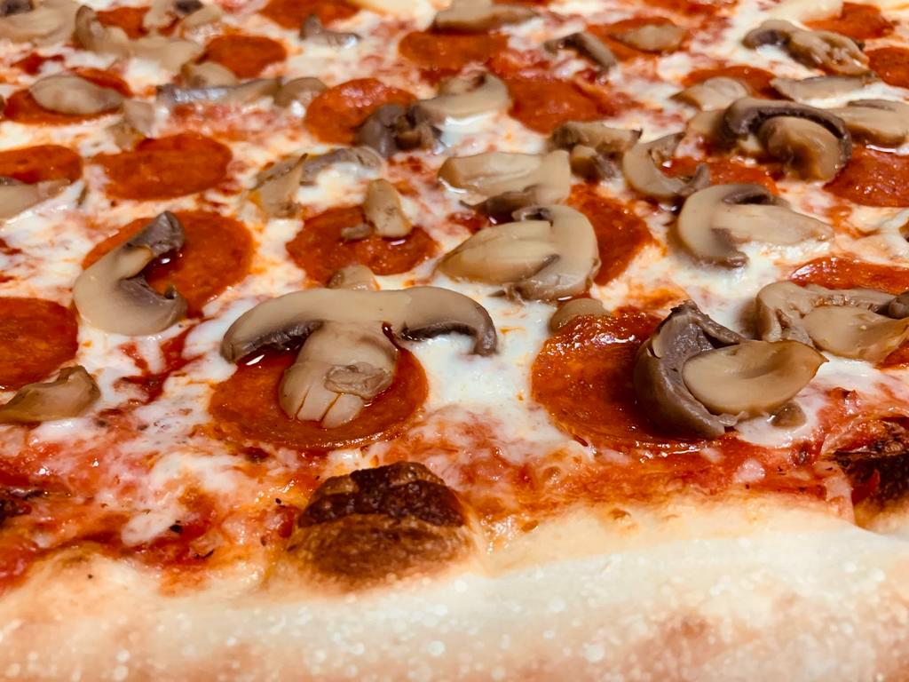 Pepperoni and Mushroom Pizza · Marinara sauce, mozzarella cheese, pepperoni and mushroom.