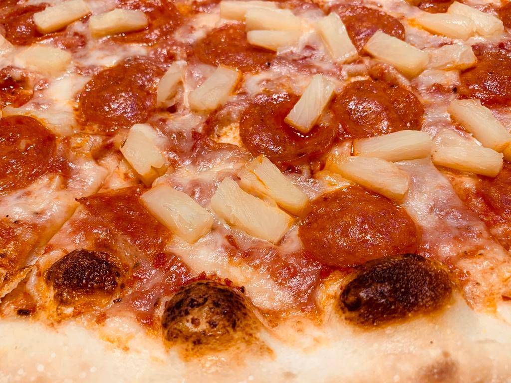 Pepperoni and Pineapple Pizza · Marinara sauce, mozzarella cheese, pepperoni, pineapple.