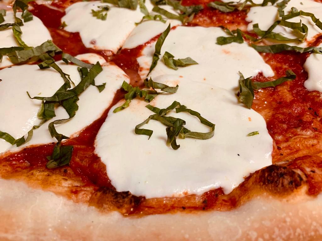 Red Margherita Pizza · Marinara sauce, fresh mozzarella cheese and fresh basil.