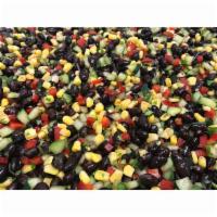 Black Bean Corn Salad · Black beans, refreshing cucumber, corn and red bell peppers tossed in Chanos' jalapeno vinai...