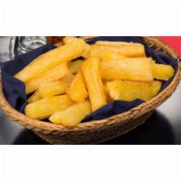 Yuca Fries · Delicious potato like wedges, crispy outside and soft inside. Paired with a side of creamy c...