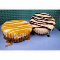Cheesecakes Bites (2) · 2  decadent, smooth & creamy cheesecake bites. Pictured w/ added caramel & chocolate. Vegeta...