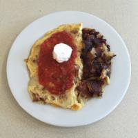 Chicken Enchilada Omelet · Chicken, bacon, sauteed onions, cheddar cheese topped with homemade salsa and sour cream. Co...