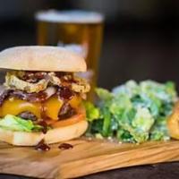 Cowboy Burger · Applewood-smoked bacon, cheddar cheese, onion rings, BBQ sauce, garlic aioli, lettuce and to...