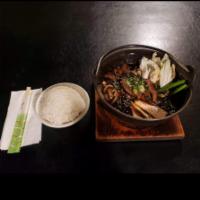 Sukiyaki · Beef, glass noodles, tofu, onion, shiitake mushrooms and napa cabbage.