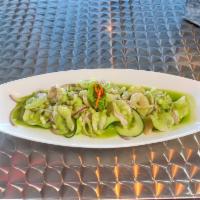 Aguachiles Verde · Fresh shrimps, cucumber, onions and avocado.