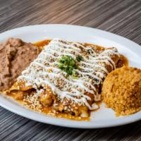5. Vegetarian Enchiladas · 3 soft corn tortillas filled with mix vegetables topped with red sauce and cheese. Served wi...