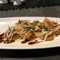 A15. Takoyaki · 4 pieces. Octopus wheat balls served with tonkatsu sauce, mayo, topped with fish flakes and ...