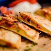 Grilled Shrimp Quesadilla · Large flour tortilla stuffed with onions, peppers, pico de gallo, Shrimp and Cheese.