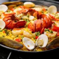 Paella Marinera Special · Per person. Yellow rice in a saffron sauce with shrimp, scallops, mussels, calamari, dams, f...