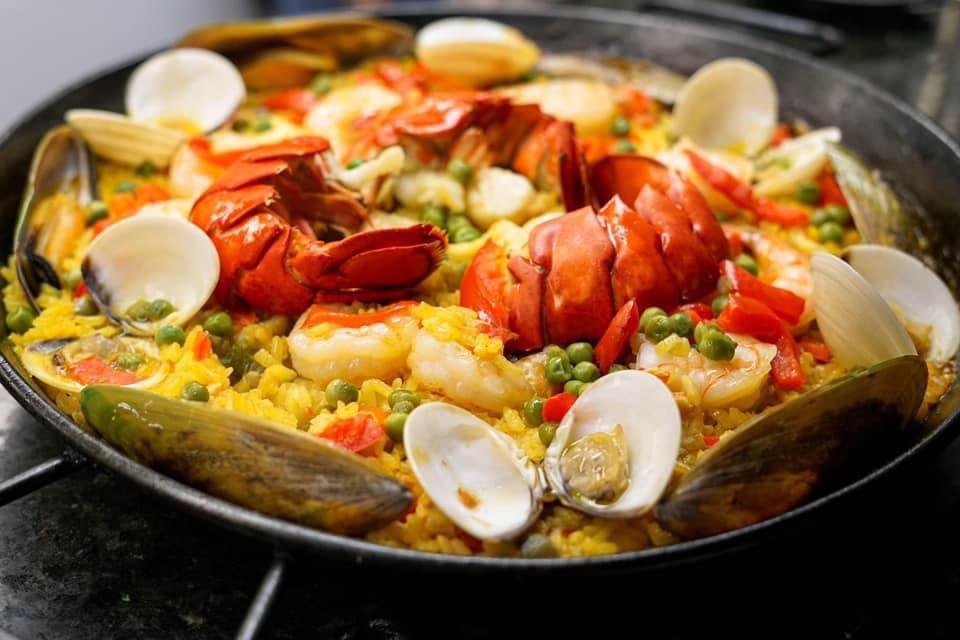 Paella Marinera Special · Per person. Yellow rice in a saffron sauce with shrimp, scallops, mussels, calamari, dams, fish, and lobster tail.  This item takes 45 minutes to an hour to prepare
