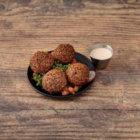 Falafel · Ground Chick Peas, served with Parsley, Tomato, Radish, and Tahini