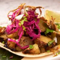 Roast chayote Taco · Roast chayote, Barrio slaw, crispy onion, soft shell corn tortilla 