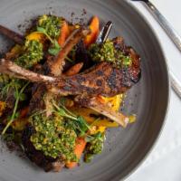 AUSTRALIAN LAMB CHOPS · Herb-roasted lamb, oak wood-smoked carrots, sweet potato, spinach and hazelnut pesto, sumac