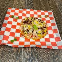 7. Cheese, Pineapple and Ham Arepizza · Arepa, cheese, mozzarella with toppings: bits of pineapple and slices of ham.