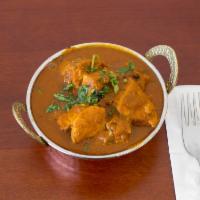 Chicken Curry · Chicken cooked in onion gravy and spice.