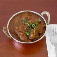Goat Curry with Bones · Traditional home style curry goat.