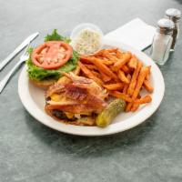 Hickory Burger · Applewood-smoked bacon, caramelized onions, and melted cheddar cheese served with BBQ sauce.