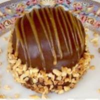 Peanut Butter Explosion · A chocolate candy bar bottom, topped with a layer of peanut butter ganache and a mound of ch...
