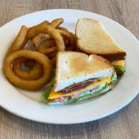 BLT Sandwich · Smoky bacon, lettuce, tomato, cheddar and mayo. Served with house fried chips or mixed green...