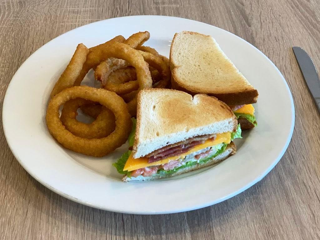 BLT Sandwich · Smoky bacon, lettuce, tomato, cheddar and mayo. Served with house fried chips or mixed green salad.