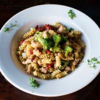 Rotini Tuscany Pasta · Rotini pasta with sautéed chicken, broccoli, sun-dried tomato, fresh garlic, thyme, Parmesan...