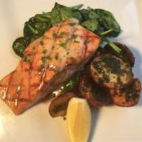King Salmon Entree · Grilled, ancho honey lemon glaze, wilted spinach, lemon butter, and roasted herbed baby red ...
