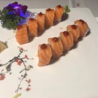 14. Pink Lady Roll · Spicy salmon, cucumber inside wrapped with soy bean paper, topped with salmon & hot sauce.