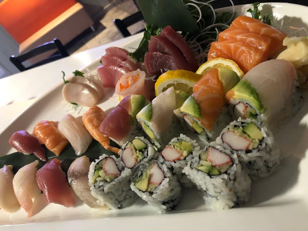 9. Sushi Sashimi For 2 · 9 pieces sushi, 14 pieces sashimi, 1 California roll & 1 rainbow roll.
