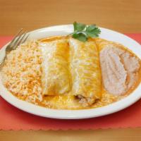 Enchiladas Rojas · 3 corn enchiladas stuffed with chicken or beef and topped with a delicious enchilada sauce a...