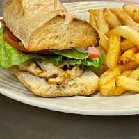 Flanders' Grilled Chicken Sandwich · Marinated chicken cutlet, avocado, tomato, Gruyère cheese, mayonnaise and frites.