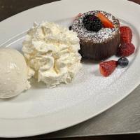 Callebaut Molten Chocolate Cake · Berries, vanilla ice cream and whipped cream.