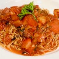 Capellini Checca (Dinner) · Angel hair pasta tossed with sauteed garlic, fresh basil and ripened tomatoes.