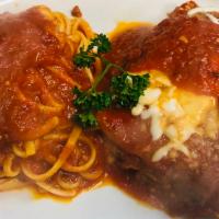 Eggplant Parmigiana (Dinner) · Sliced eggplant layers in marinara and Parmesan sauce, oven-baked.  Served with linguine mar...